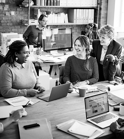 Marketing team working, representing WeKinnect Global's full marketing management service in Texas, allowing clients to focus on their core business.